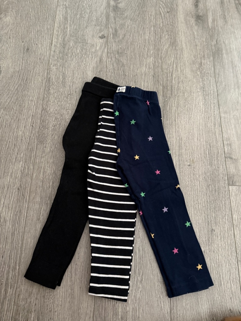 GAP Kids Black, White Stripe, and Navy Star Leggings Trio